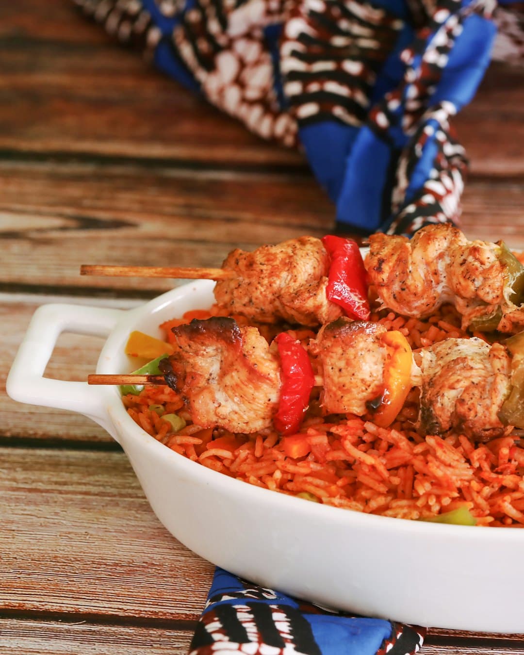 Jollof rice with chicken kebabs