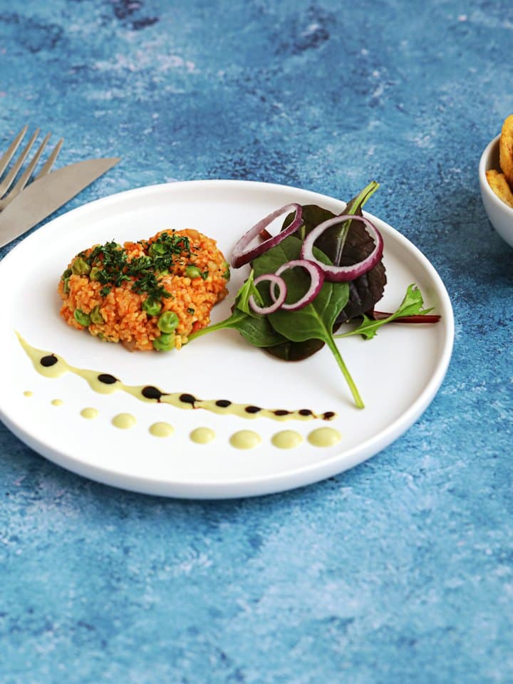 Plated rice with fresh salad